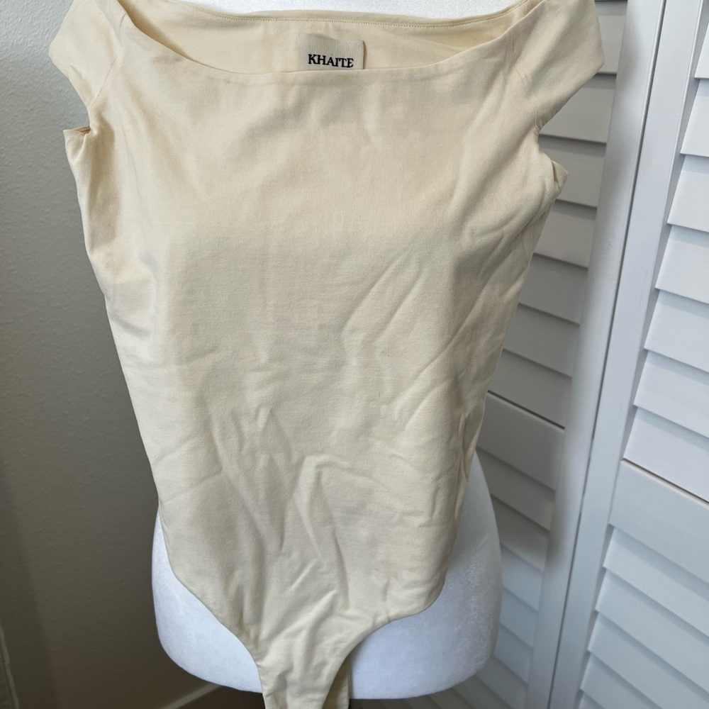 Khaite Cream off-shoulder bodysuit Top